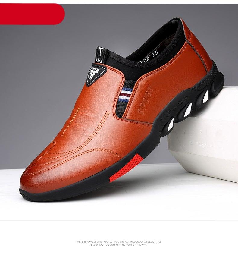 Orange leather slip-on sneakers with contrast side accents and cushioned grip sole