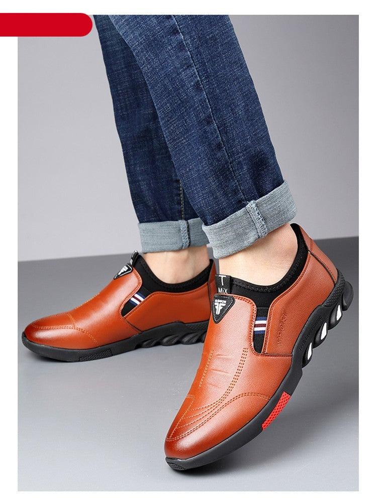 Orange leather slip-on sneakers with contrast side panels and cushioned rubber outsole