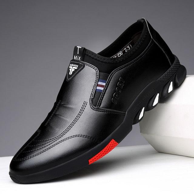 Men's black slip-on casual shoes with cushioned lining and red-accent side sole