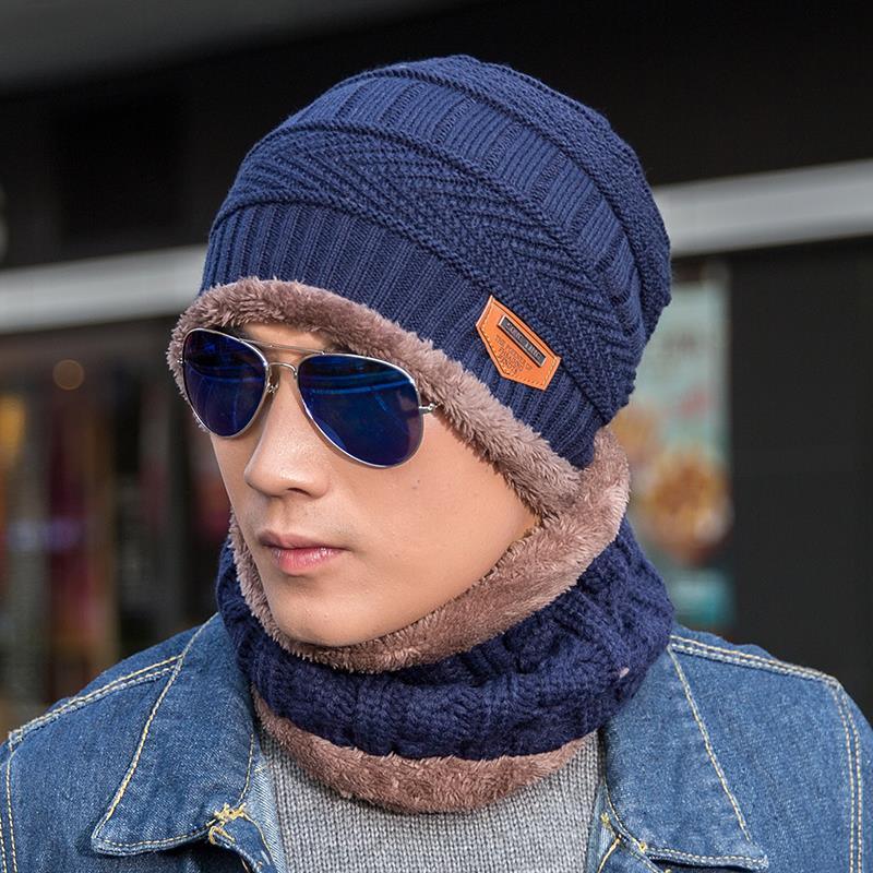 Navy knitted beanie with faux-fur lining and matching brown neck warmer set