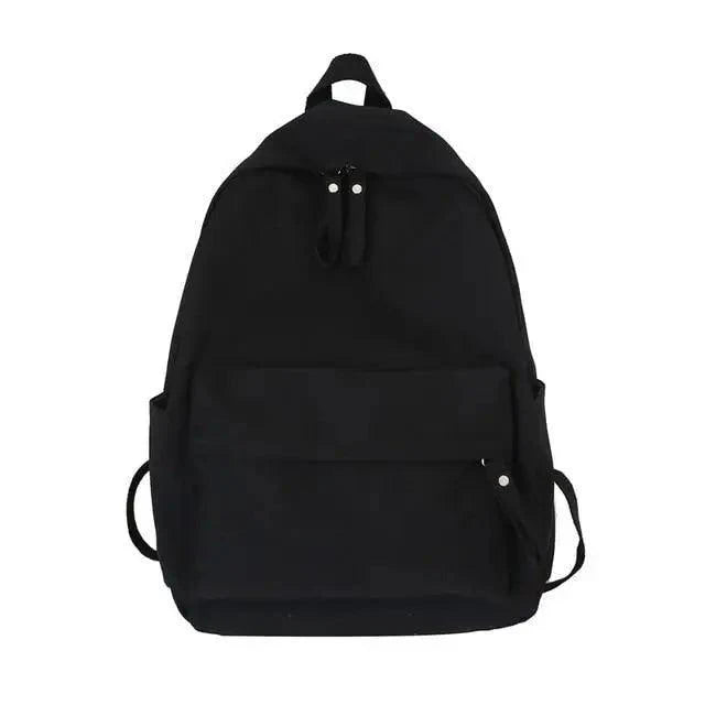 Black canvas-style backpack with front pocket, dual zipper pulls, and top handle