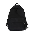Black canvas-style backpack with front pocket, dual zipper pulls, and top handle