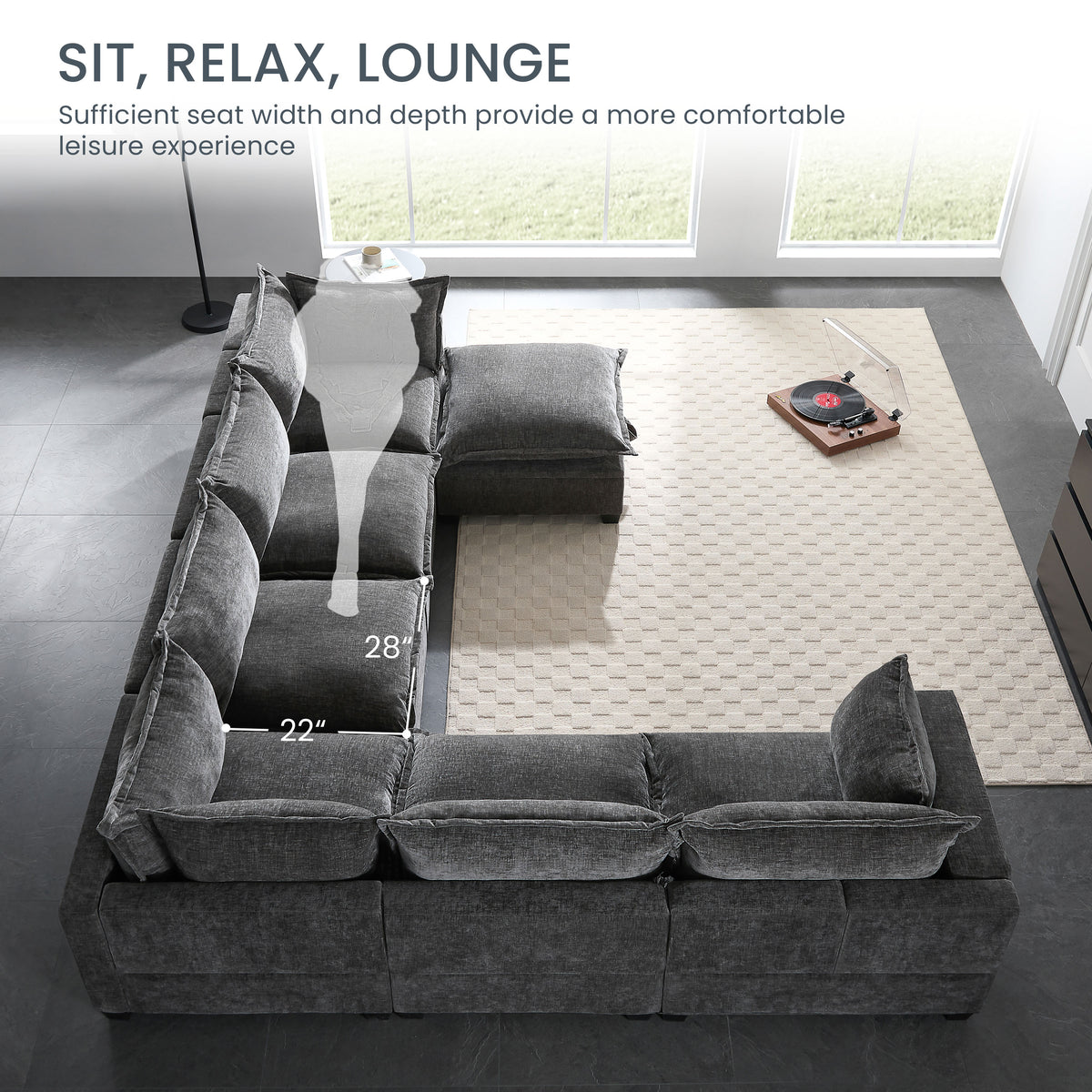 Dark gray chenille modular sectional sofa with movable storage ottoman and throw pillows.