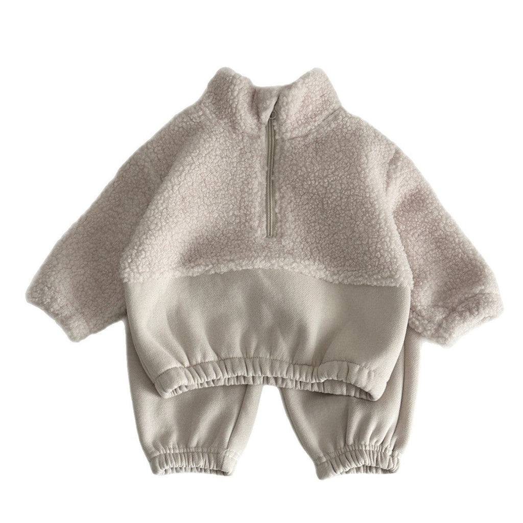 Front view of light beige lambswool half-zip sweater with stand-up collar