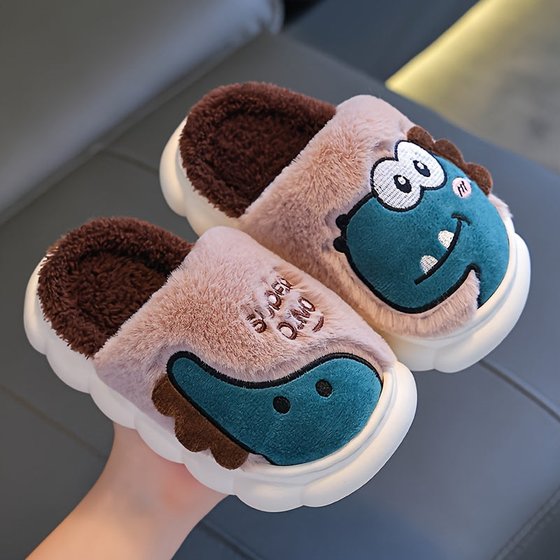 Girls' dinosaur slippers, close-up pair in brown and pink with teal dino face graphics
