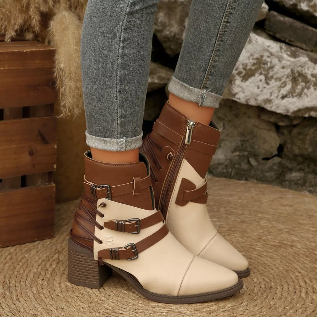 Front view two-tone ankle boots with point toe, two buckles, and block heel