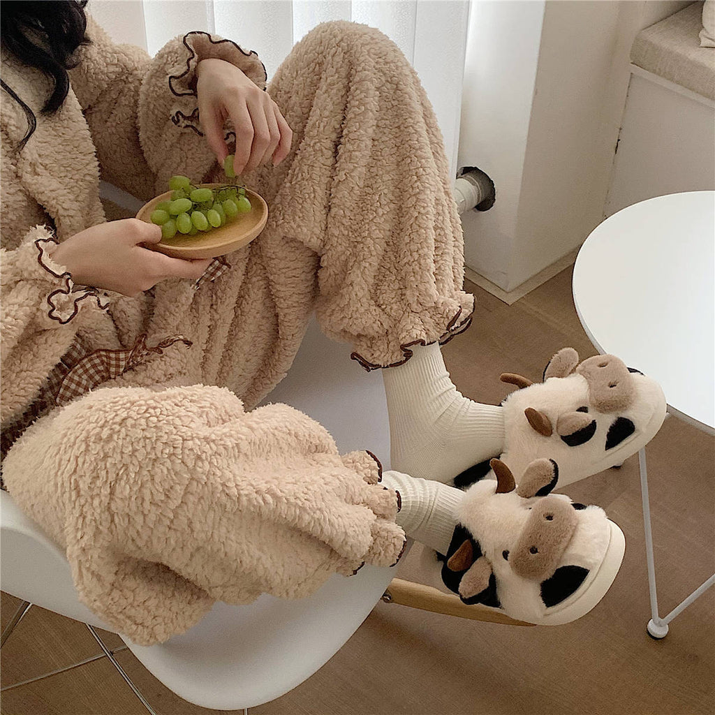 Plush cow animal slippers with cartoon face, fluffy cuff, and white open-heel slip style