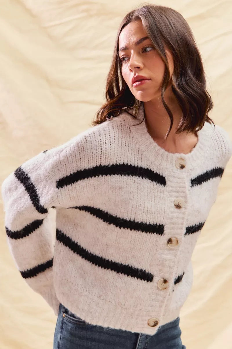 Striped knit cardigan with button placket, cream fabric and black horizontal stripe pattern