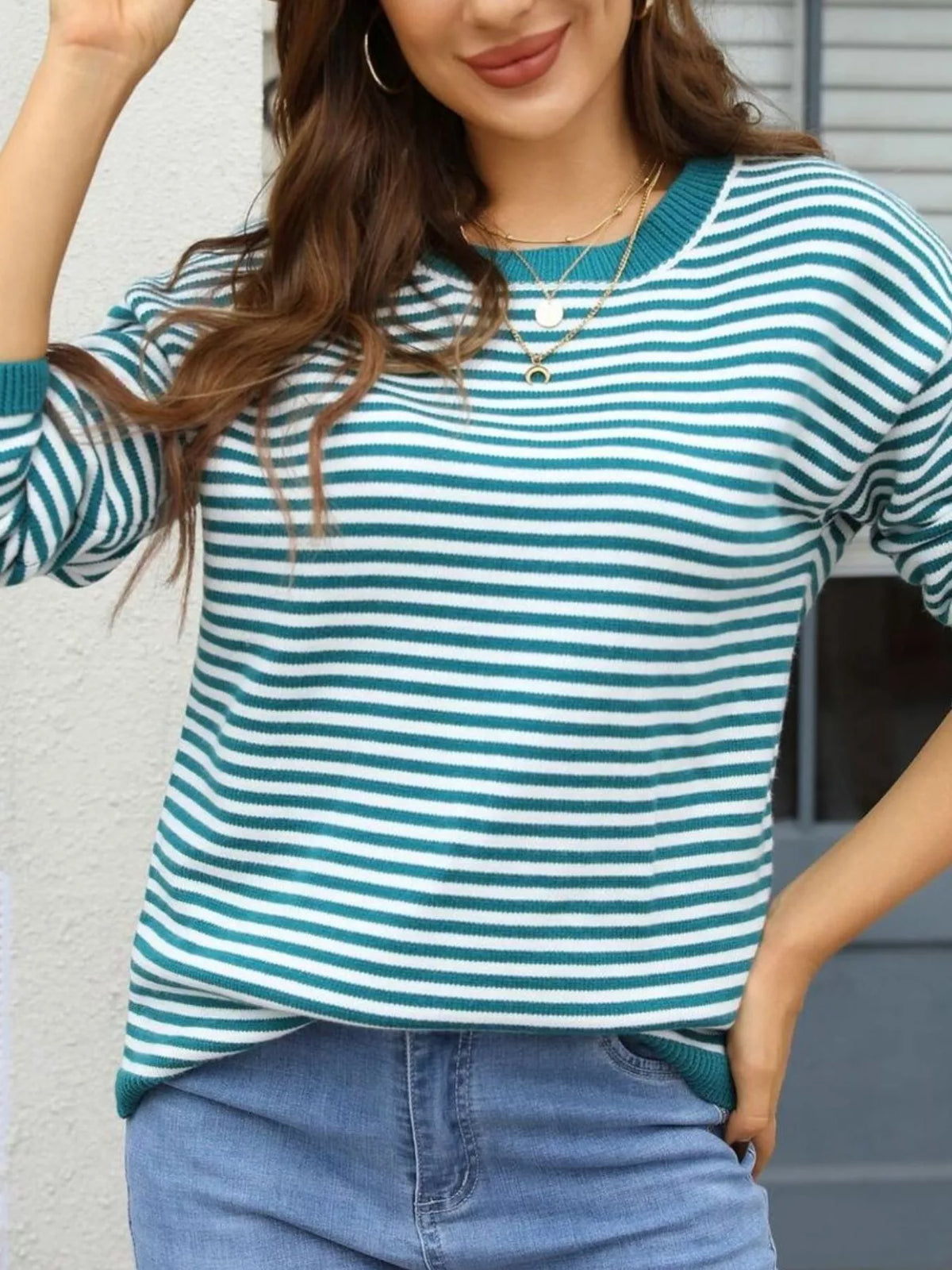 Teal-and-white striped round-neck sweater with ribbed neckline and cuffs