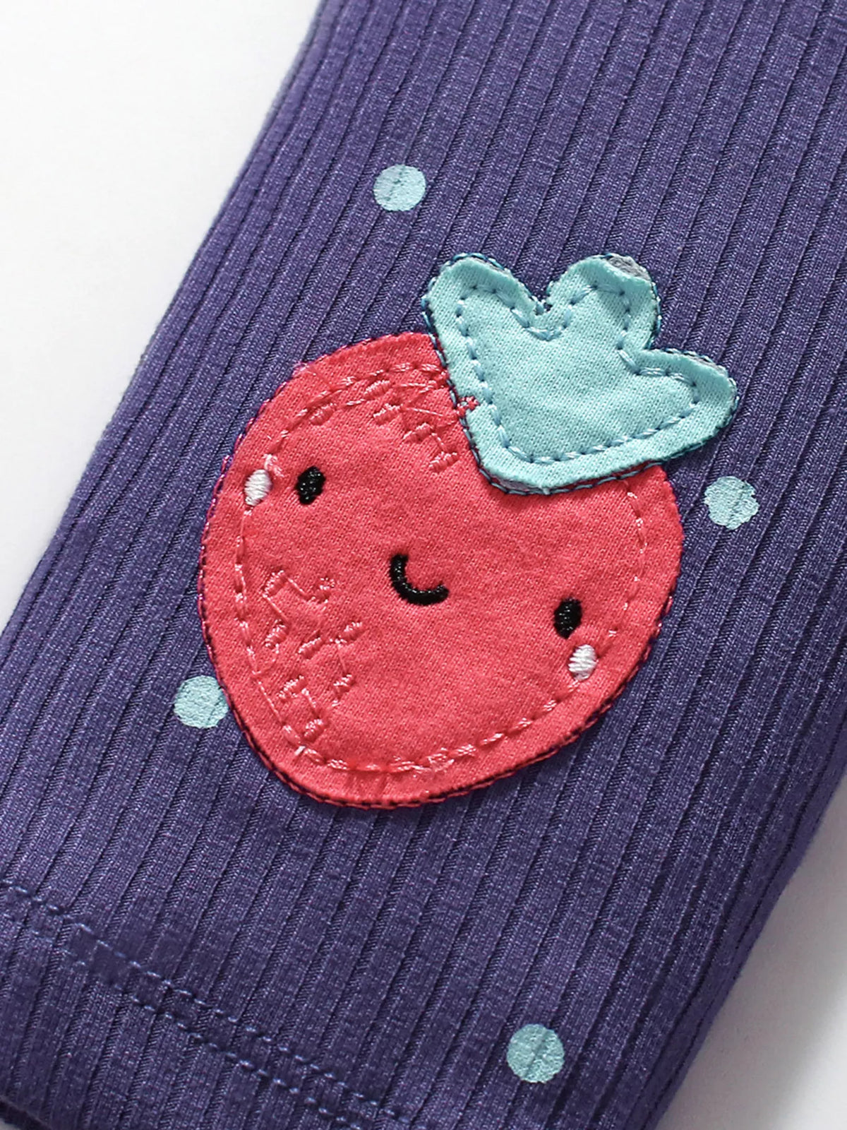 Purple ribbed leggings with stitched strawberry patch and light dot accents