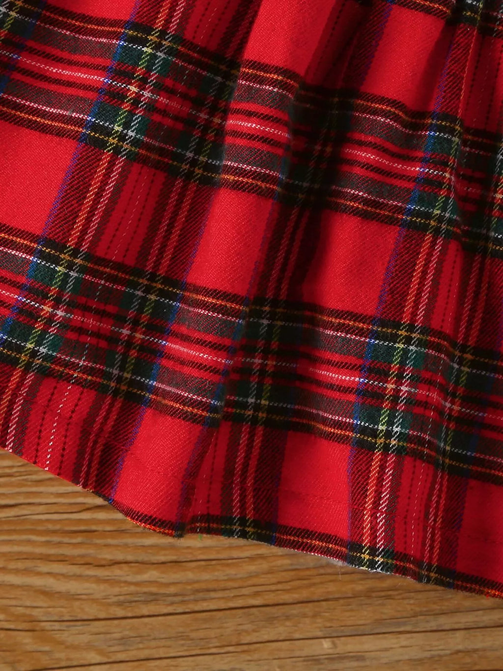 Red and green plaid dress skirt fabric with gathered waistband