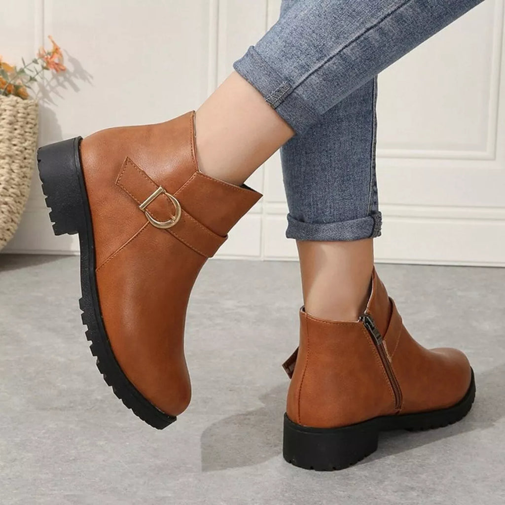 Caramel ankle boots with gold buckle detail and side zipper, stacked lug outsole