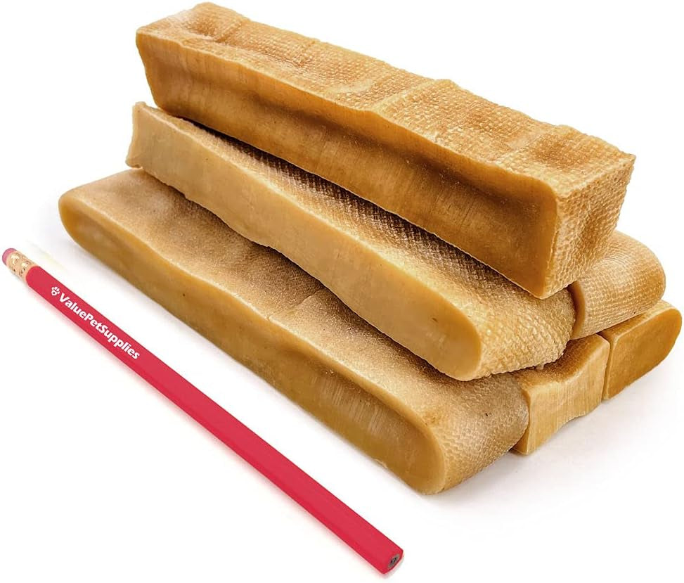 Yak cheese dog chews, X-Large sticks stacked, tan chew logs