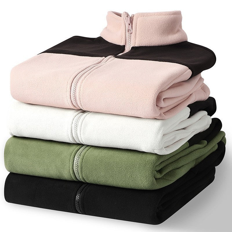 Stack of fleece liners in pink, white, green, and black for detachable jacket