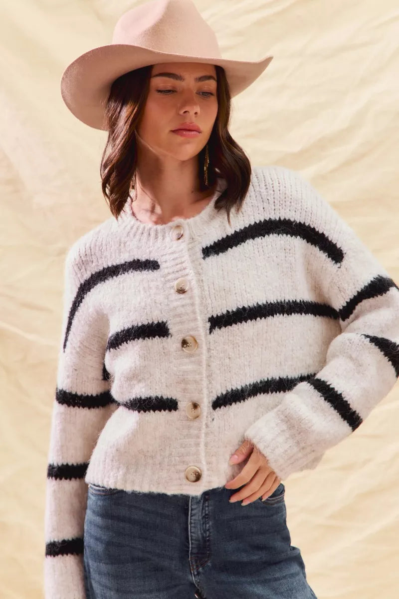 Cream striped button-front cardigan with long sleeves and black horizontal stripe detail