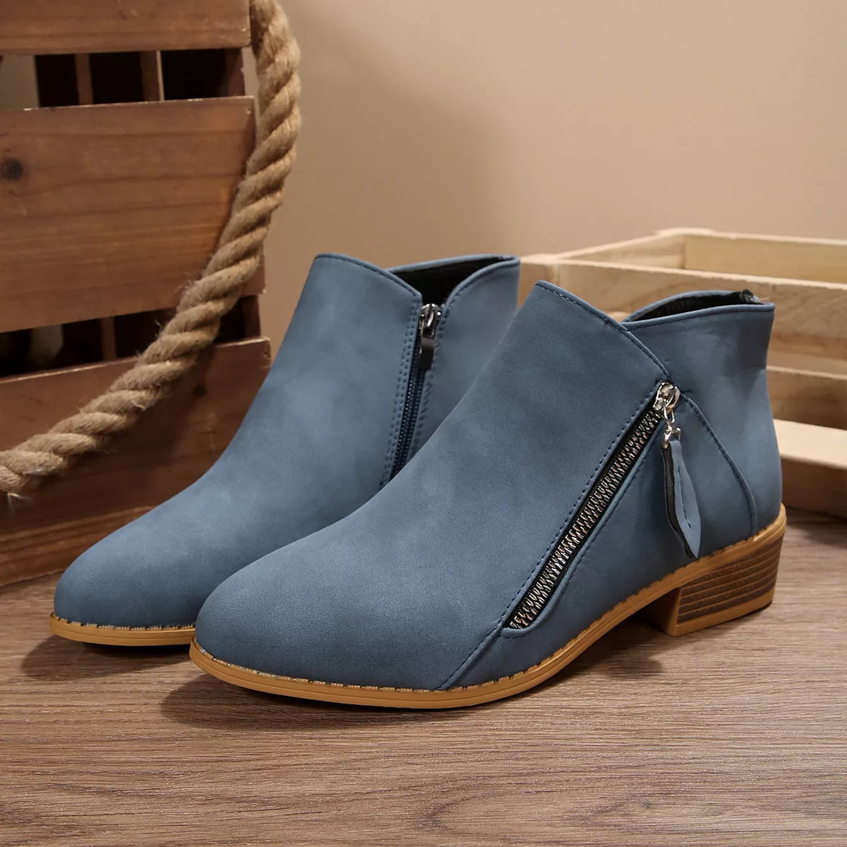 Dusty blue block-heel ankle boots with front side zipper and dark inner lining
