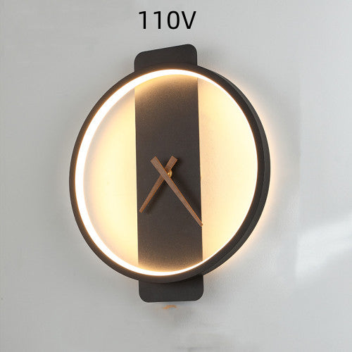 Black round clock wall lamp with warm LED ring and center clock hands