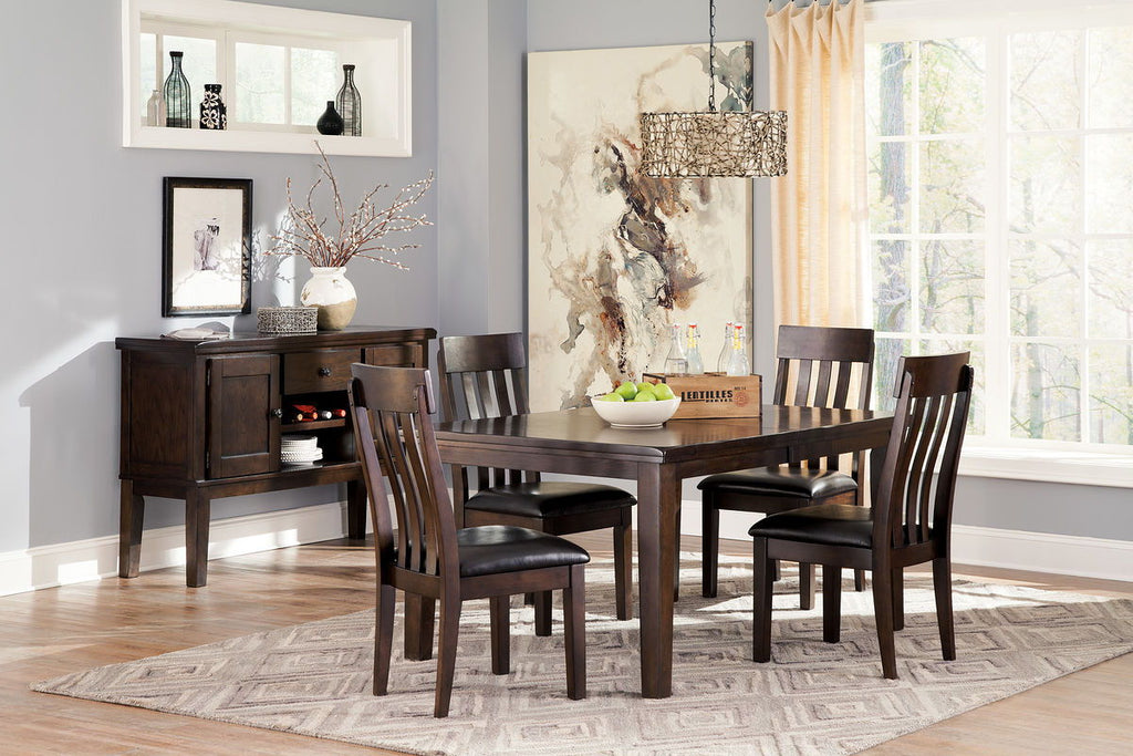 Dark brown dining table with four side chairs and bench-style seating area at one end