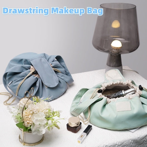 Light blue and mint green barrel drawstring makeup bags, open tops with cords