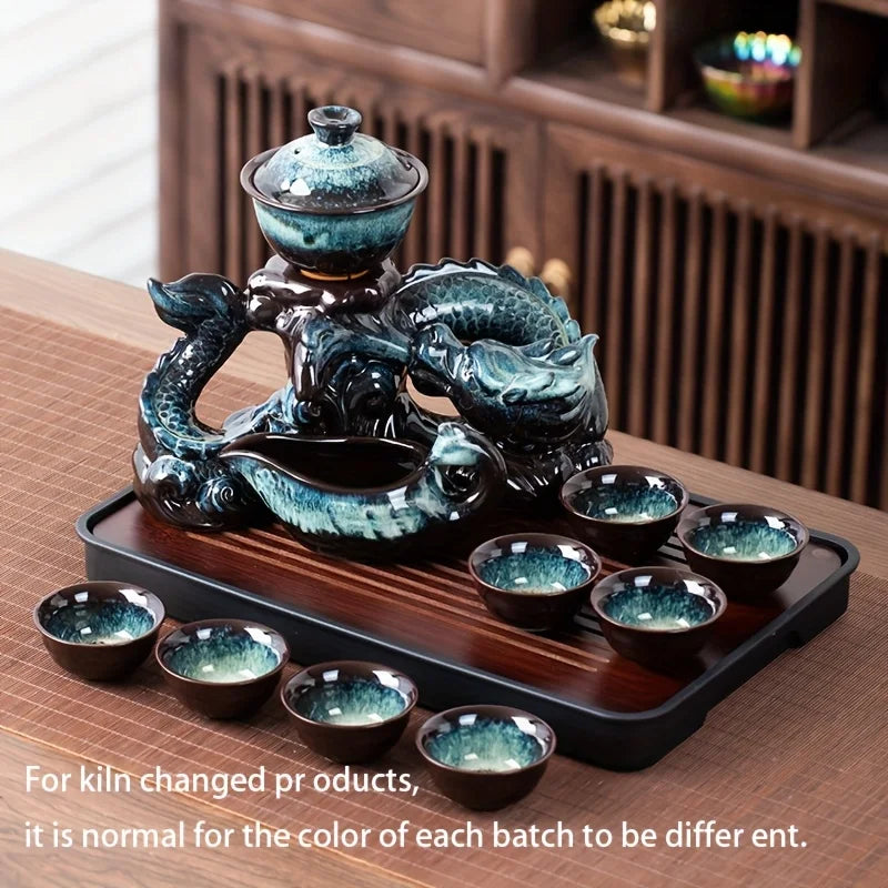 Ceramic dragon teapot set with teal glaze, multiple small cups on tray, dragon relief