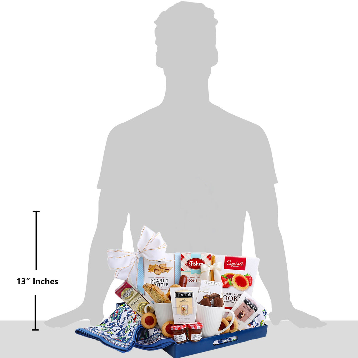 Breakfast gift basket with bow-tied towel, white cups, and assorted snack treats on tray