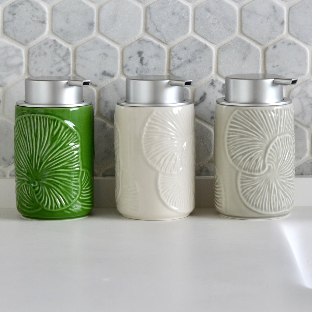 Set of three ceramic foaming soap dispensers: green and two white embossed designs