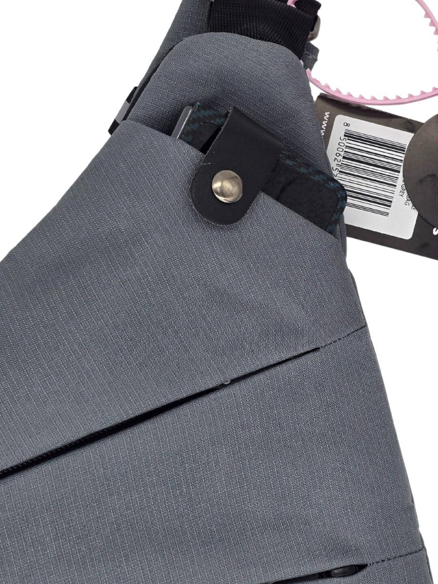 Gray crossbody bag with front flap, metal snap button, and inner card holder pocket.