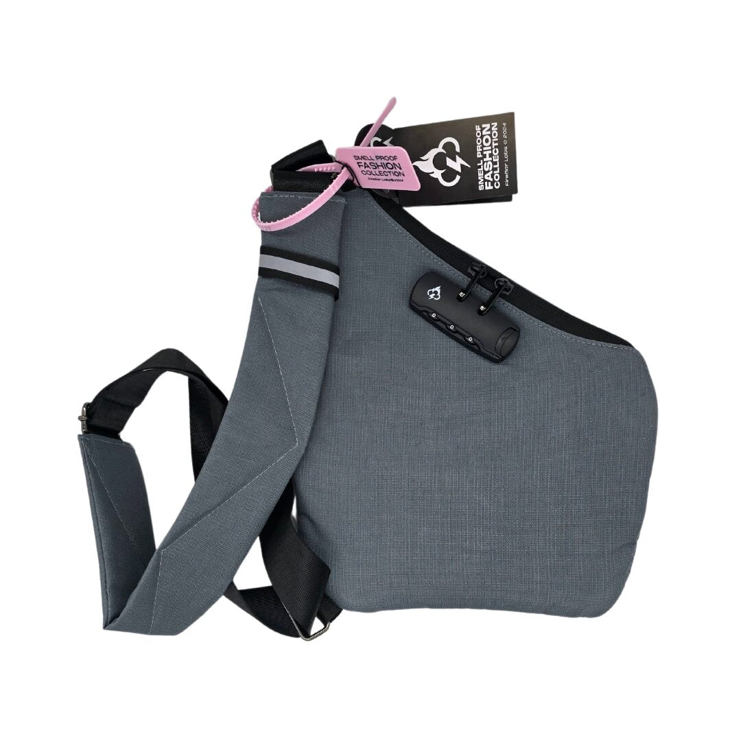 Gray crossbody bag with front pouch, hidden lock panel, and adjustable shoulder strap.