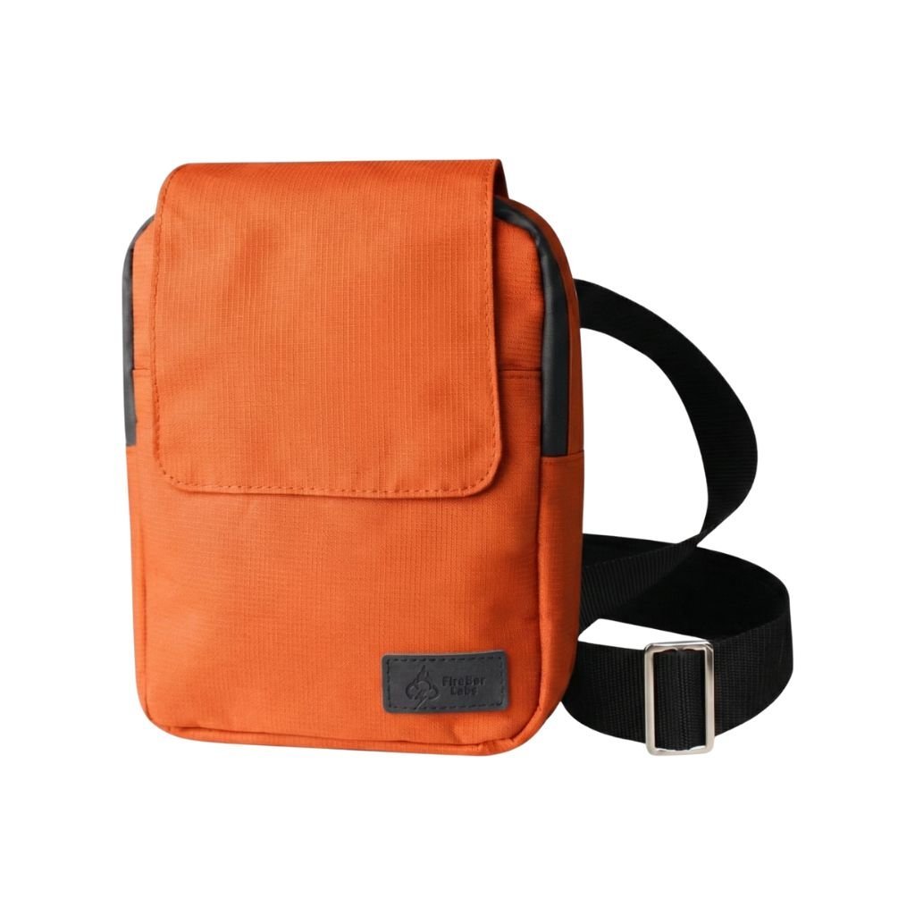 Orange ripstop messenger bag with flap front, adjustable strap, and front label patch.
