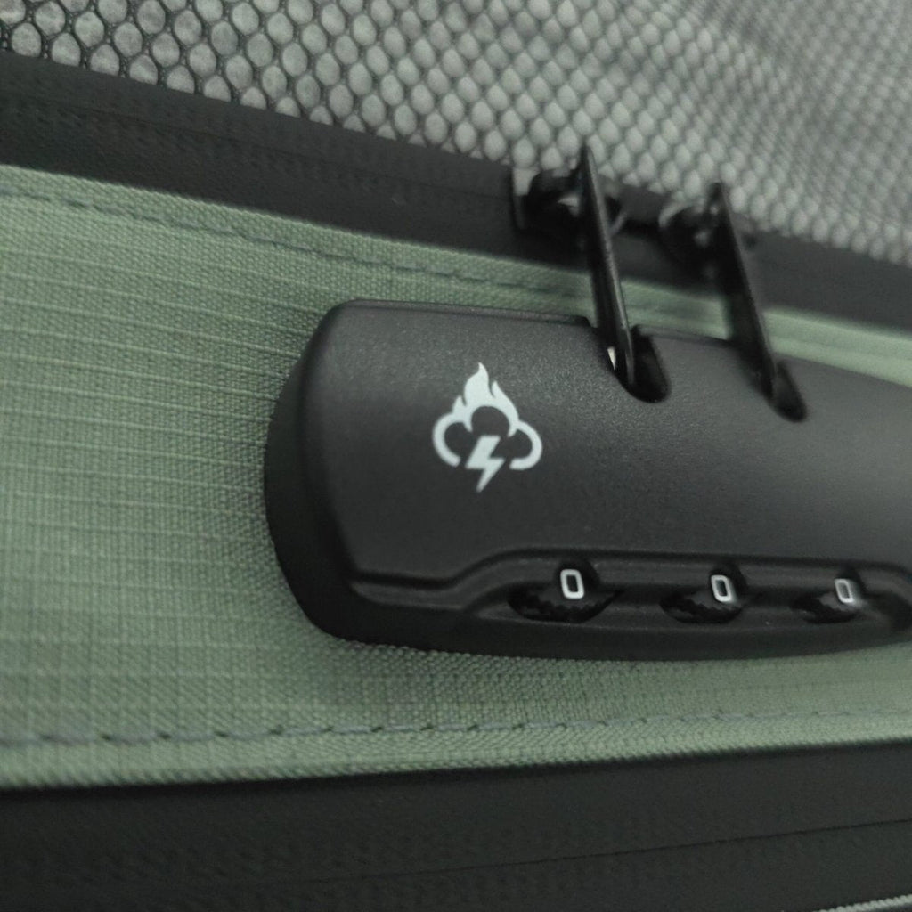 Smell proof travel wallet close-up showing black lock device inside olive fabric