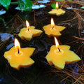 Maple leaf beeswax candles, five yellow leaf shapes with small flames