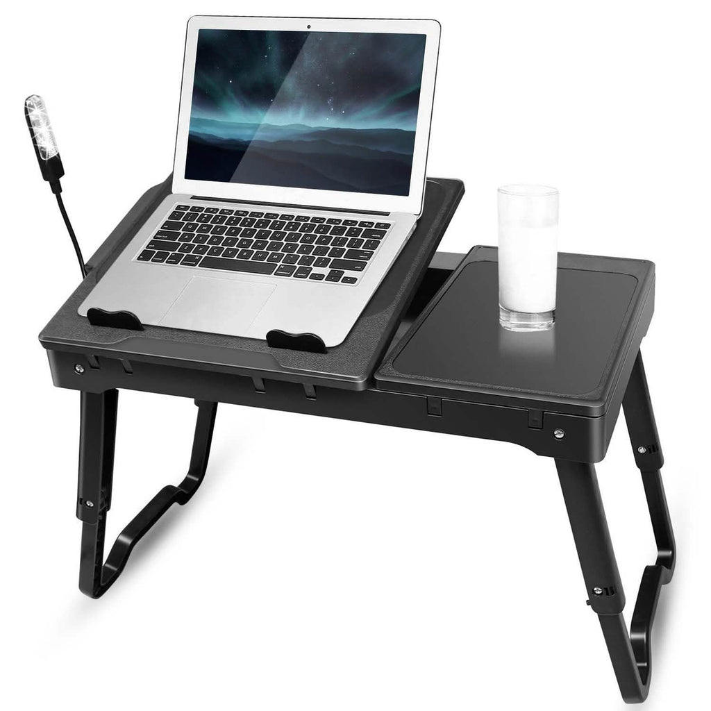 Foldable laptop desk with fan tray and side panel, supporting an open laptop