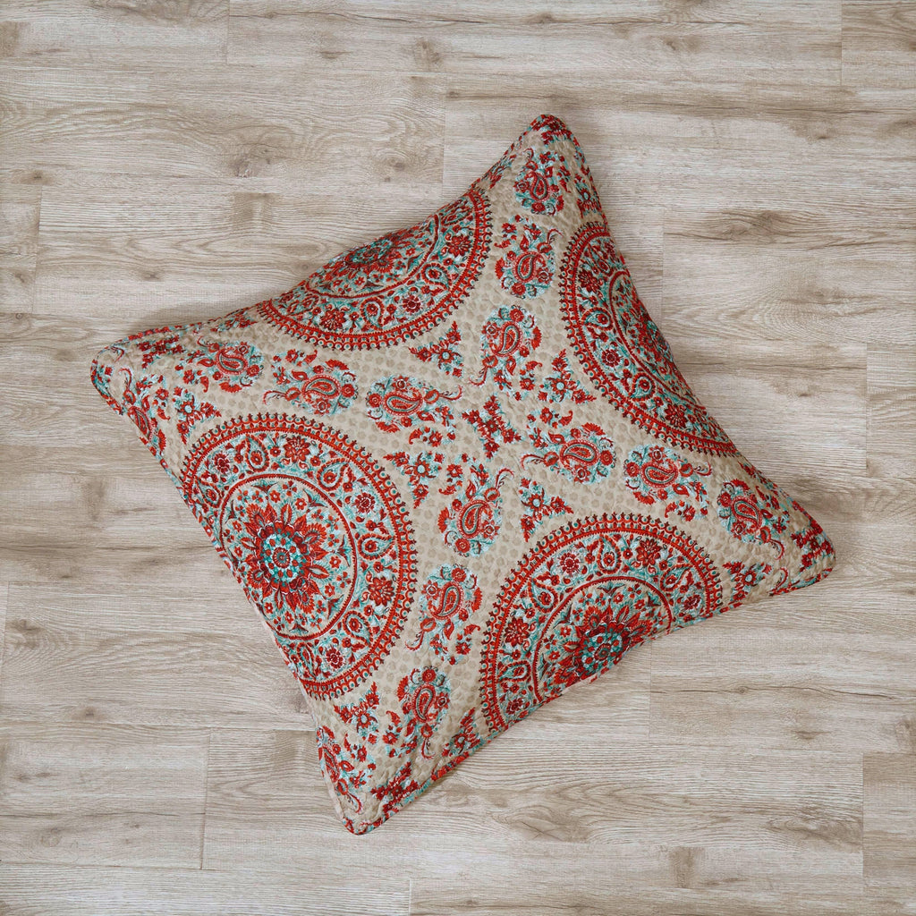 Square boho paisley pillow cover featuring red and teal ornamentals on off-white ground