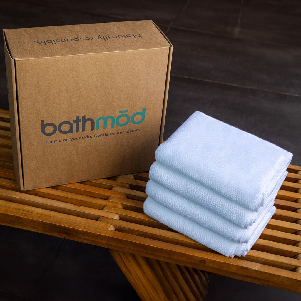 Light blue bath mat stack, neatly folded for storage