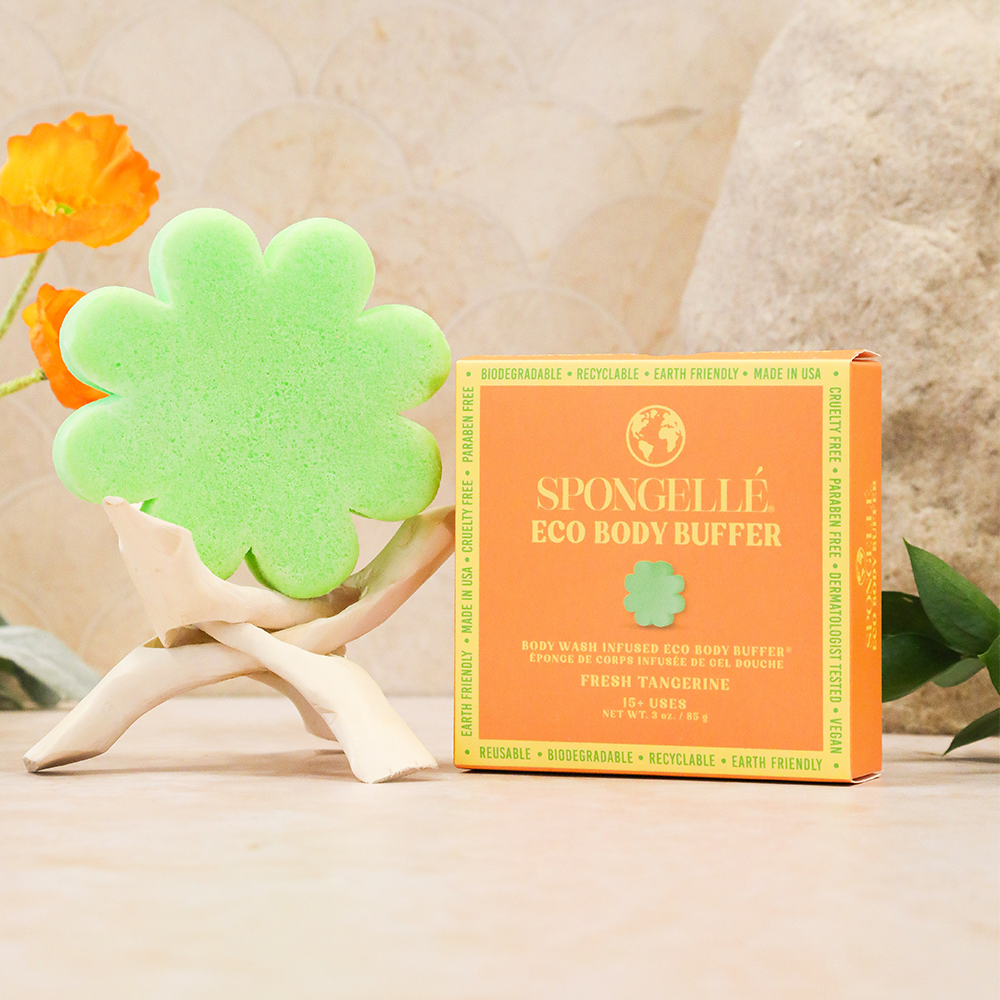 Green flower-shaped eco body buffer sponge with Fresh Tangerine product box