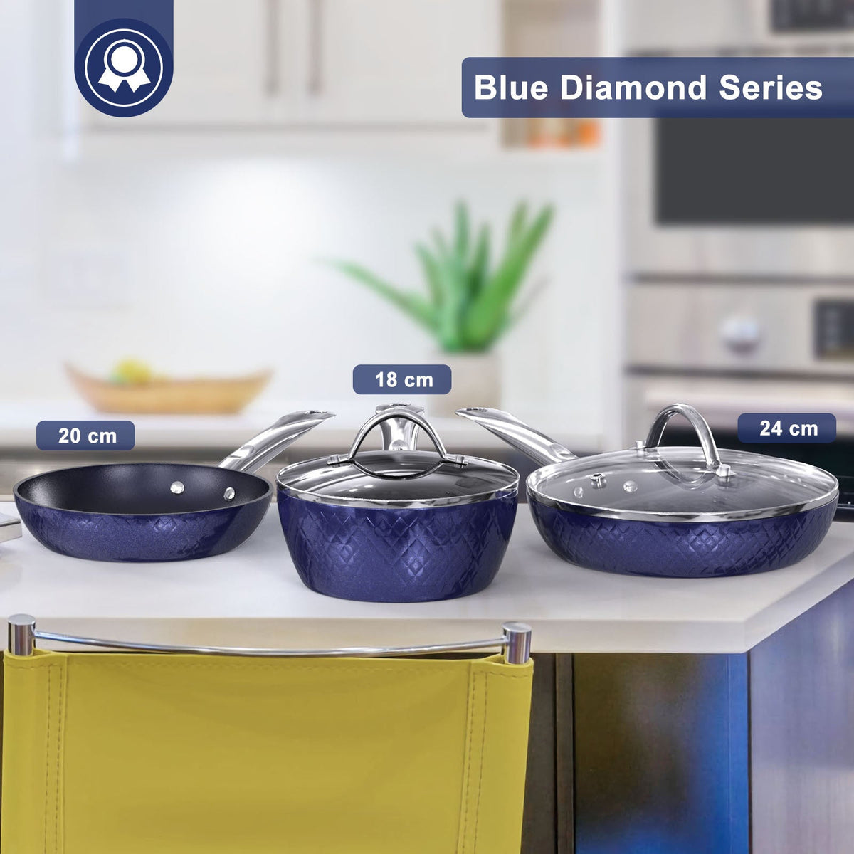 Blue diamond-pattern cookware set with three frying pans and matching lids