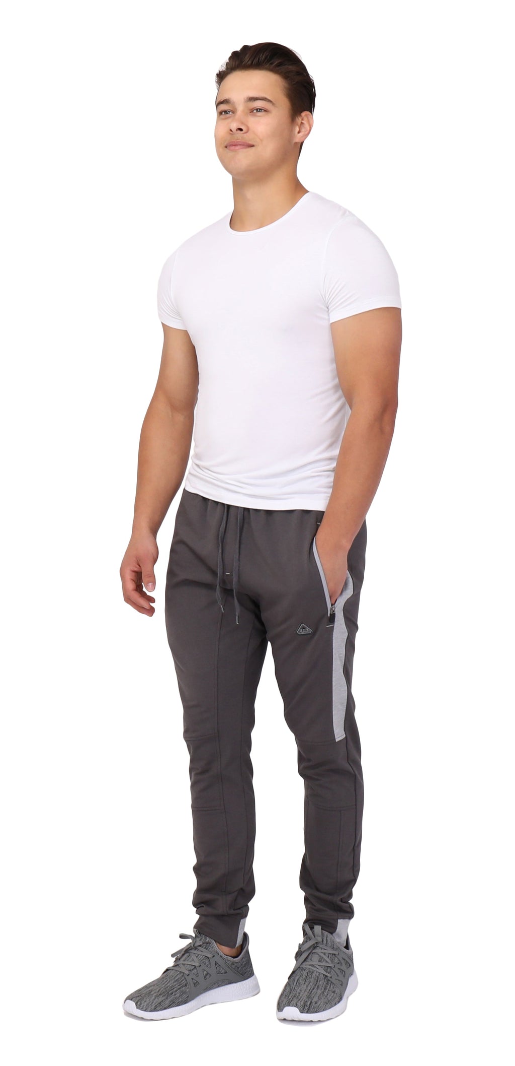 Tall fit jogger pants in dark color with side stripe, elastic waistband, and tapered legs