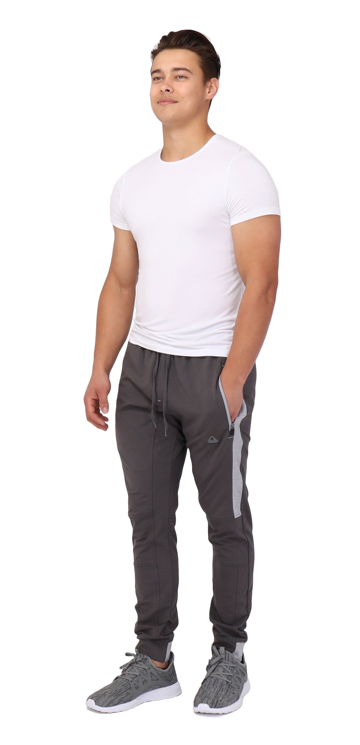 Tall fit jogger pants in dark color with side stripe, elastic waistband, and tapered legs