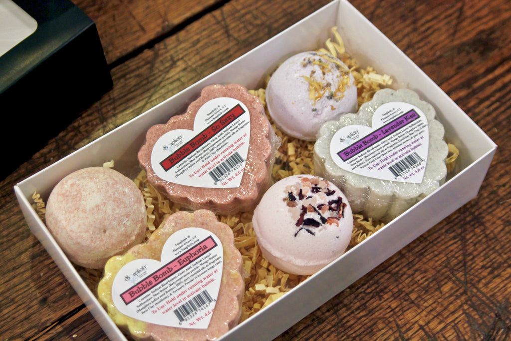Assorted heart-shaped bath bombs in white gift box tray