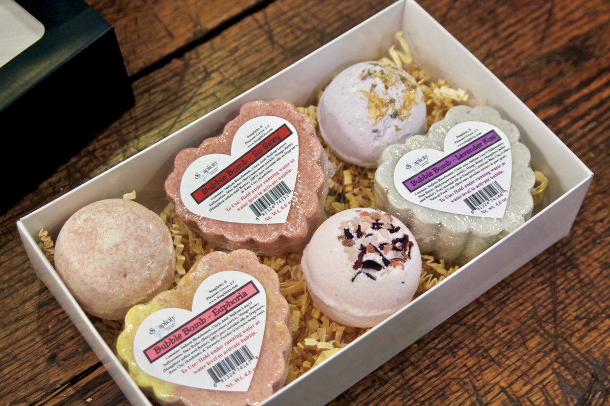 Assorted heart-shaped bath bombs in white gift box tray