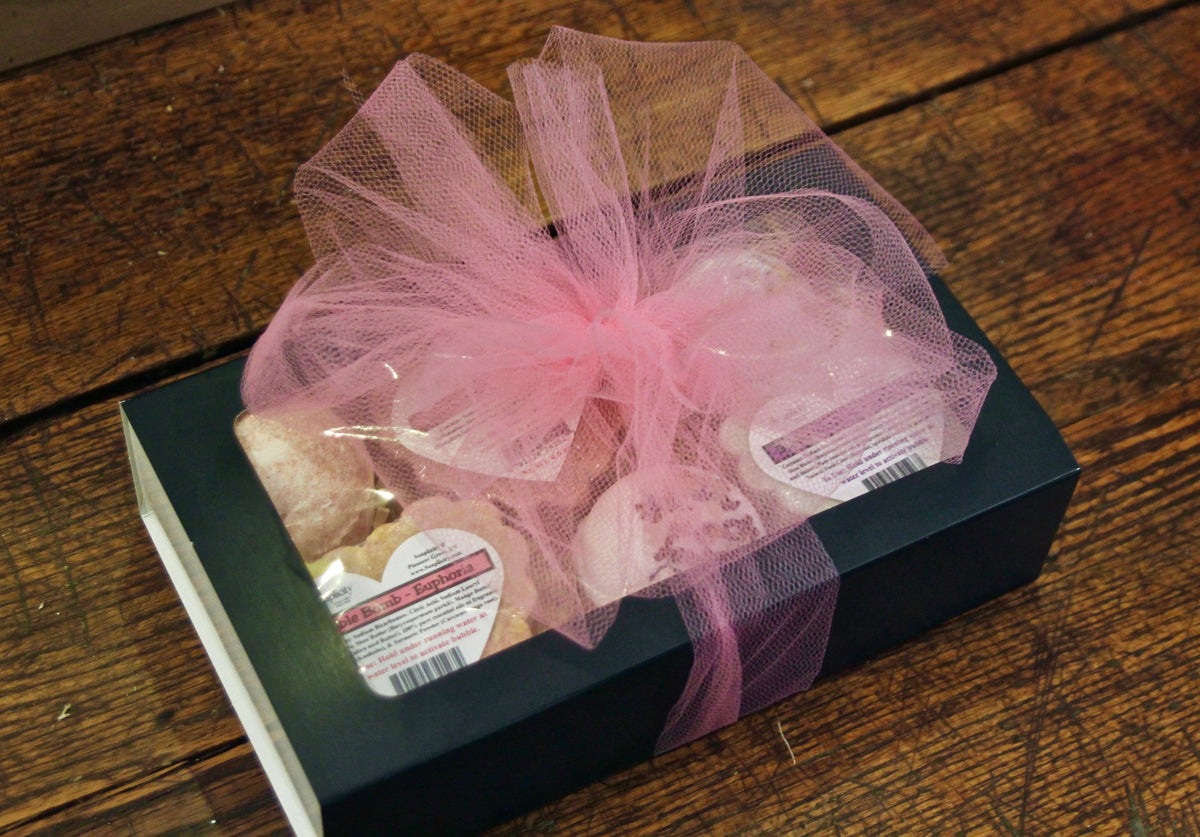 Bath bomb gift box with pink tulle bow and mesh wrap