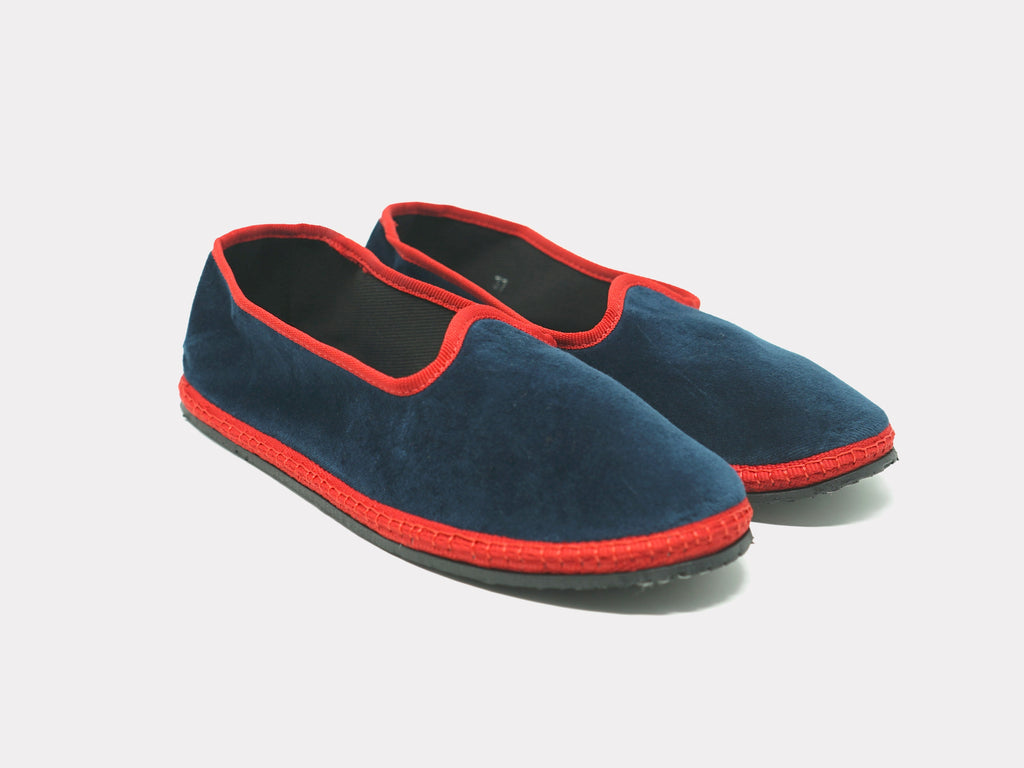 Unisex navy suede slip-on slippers with red contrast trim and low rubber sole