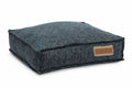 Midnight geometric pet lounger bed in dark denim with stitched bolster and tan label