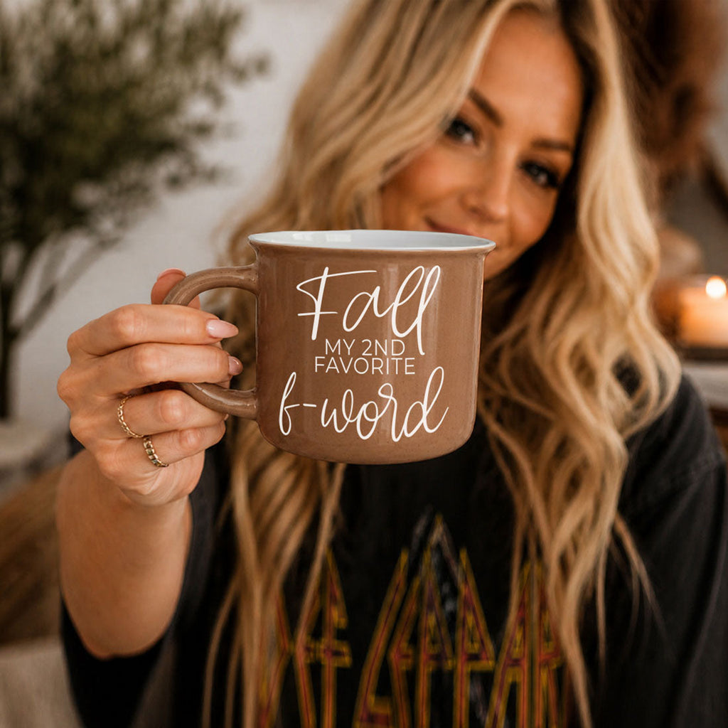 Blonde woman holding taupe mug labeled 'Fall my 2nd favorite f-word'