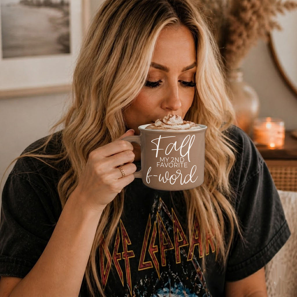 Woman sipping from taupe mug with 'Fall my 2nd favorite f-word' print