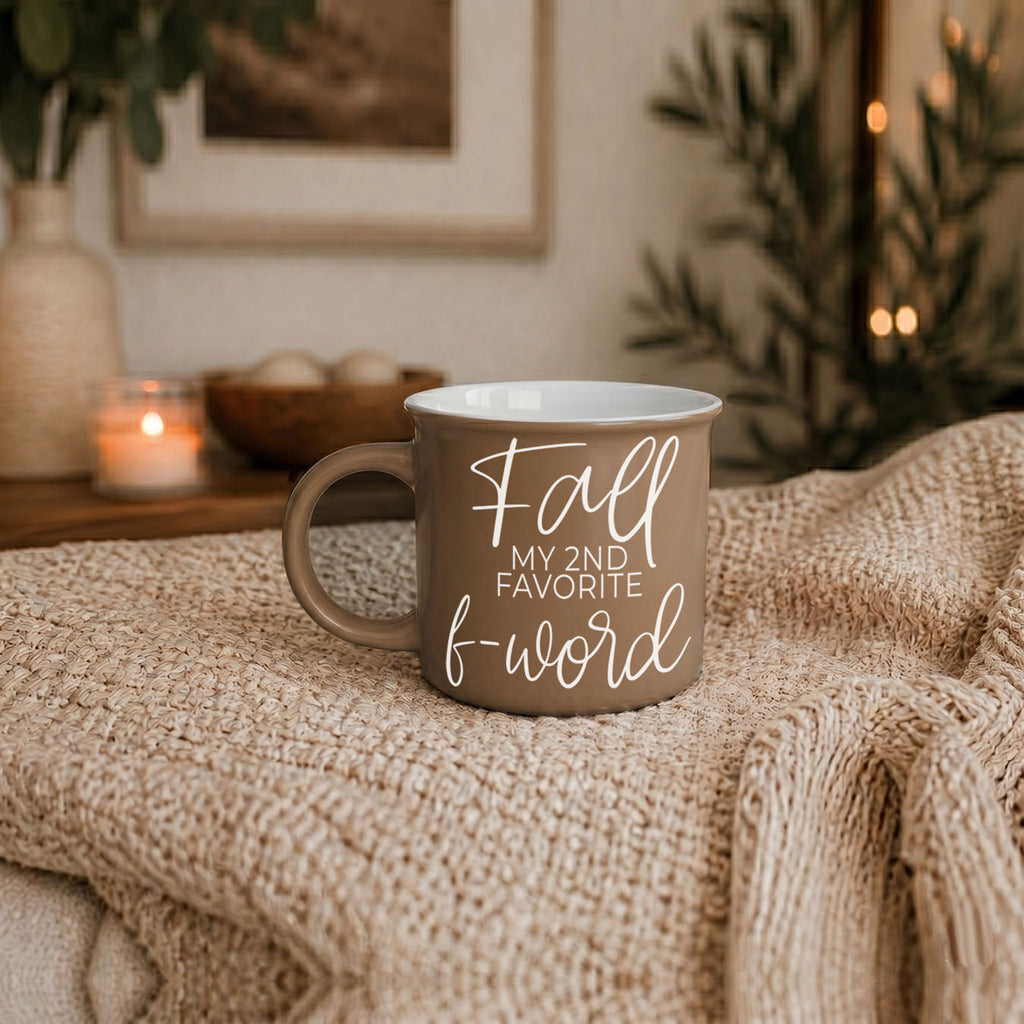 Taupe mug resting on knit blanket, 'Fall my 2nd favorite f-word' visible