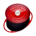 Red enamel oval pot with matching lid and side handles, LAVA label on top