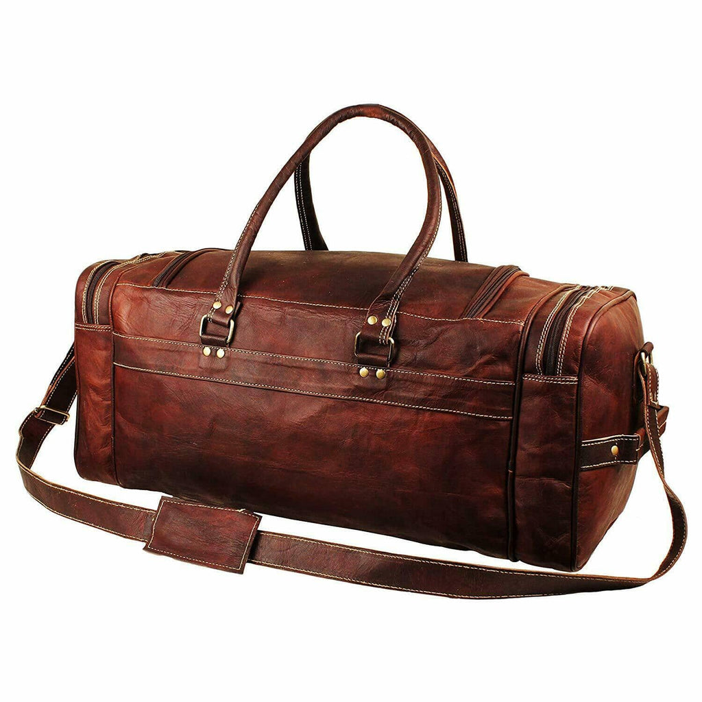 Brown leather duffle with front strap buckle, top handle, and crossbody shoulder strap