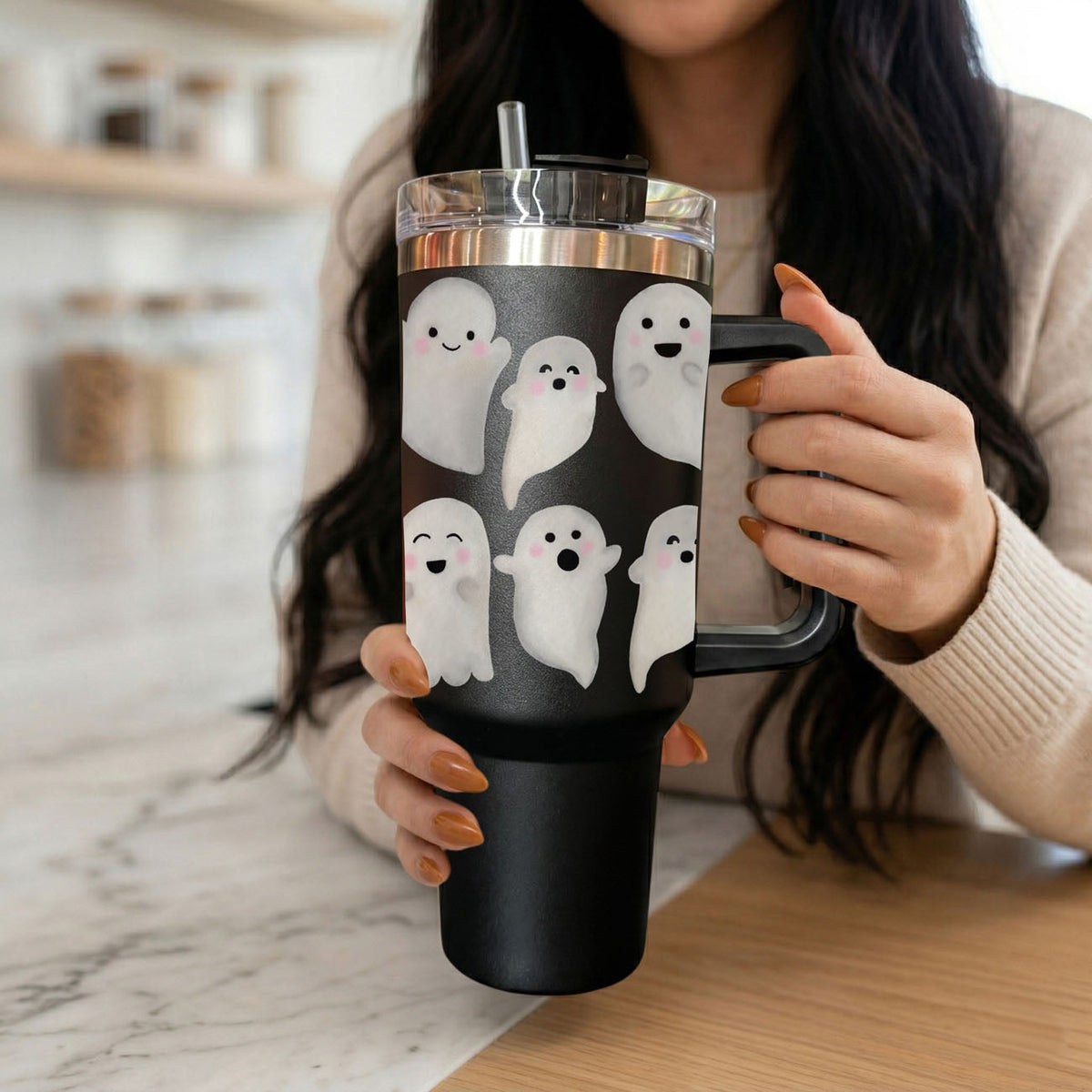 Front view of black 40oz tumbler with white ghosts and clear straw lid