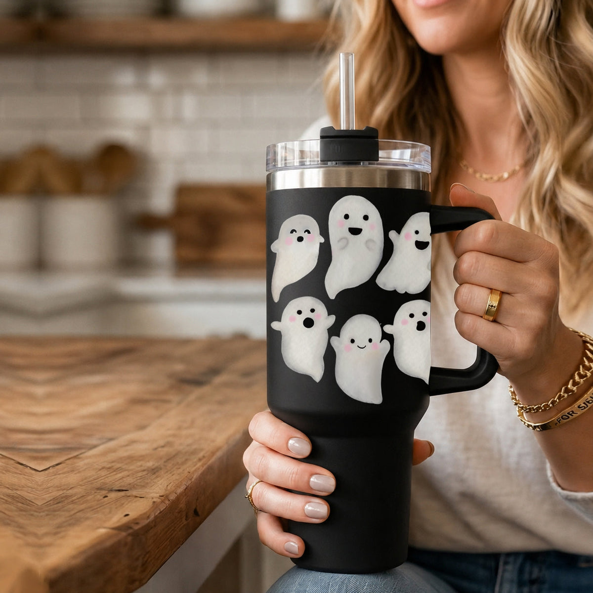 Black 40oz tumbler with handle, clear lid, straw, and white ghost faces